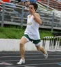 young man running on a track