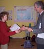 Student shaking hands with teacher at Dutch Invincibility School