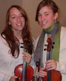 Young ladies holding their violins