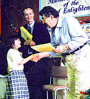 teacher shaking young student's hand