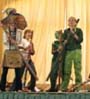 students performing on stage