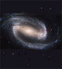 A galaxy floats in empty space